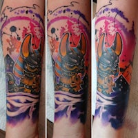 a tattoo of an egyptian eagle on the forearm